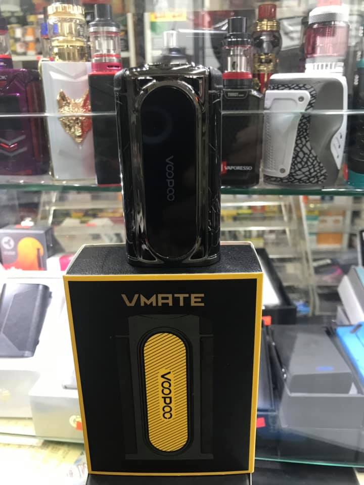 Voopoo VMATE vape device displayed on its packaging box inside a store.