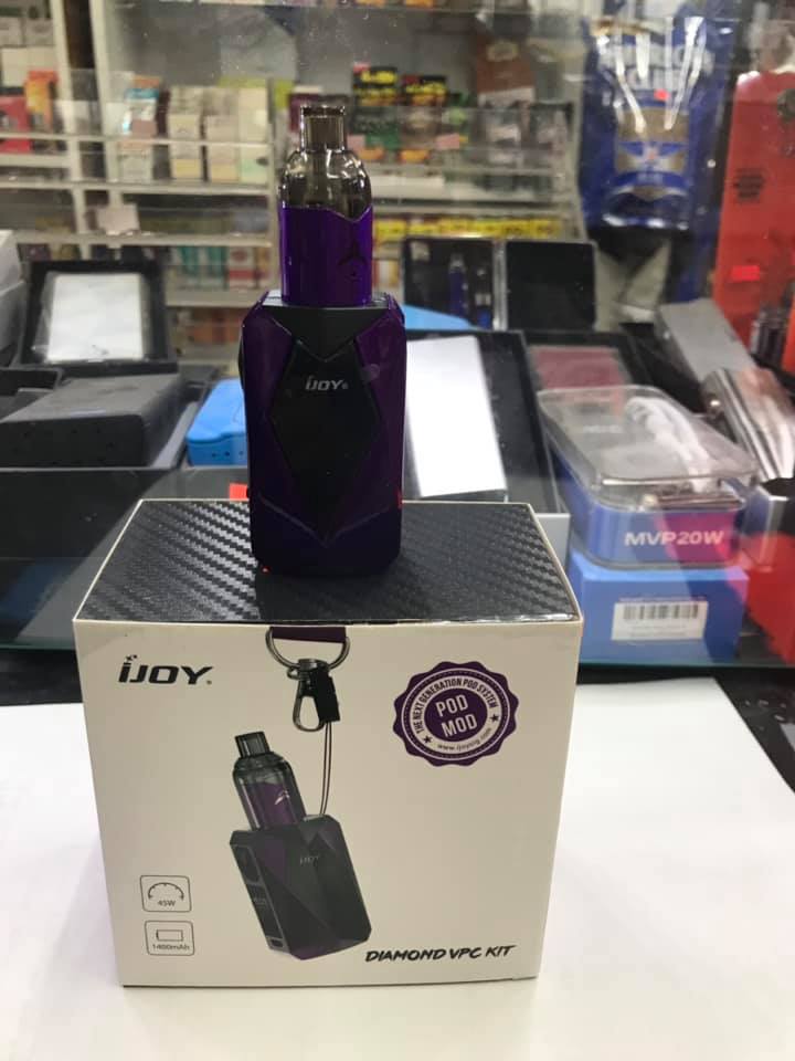 Purple iJoy vape device placed on top of its product box labeled "Diamond VPC Kit" in a retail setting.